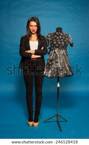 Woman with mannequin, on blue background