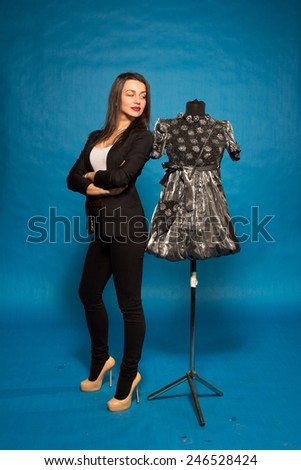 Woman with mannequin, on blue background