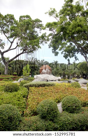 Views of the garden with a small fountain in the middle.