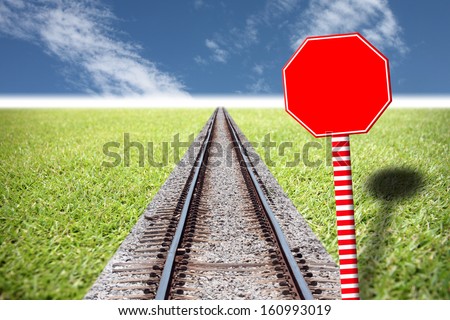 Railway traffic on the lawn and red Traffic signs.