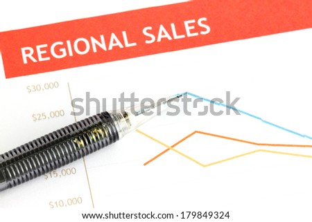 Closeup Mechanical pencil point to dot on Regional sales graph.