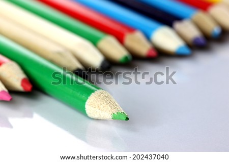 Several colored of crayon is arranged on white background.