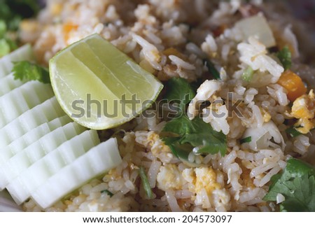 Lemon on fried rice with crab for food background.