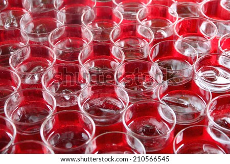 Red beverage in glass for drinks background.