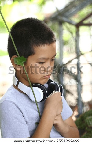 Similar – Image, Stock Photo Peaceful child daydreaming while lying on horse