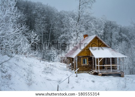 Log cabin the winter woods