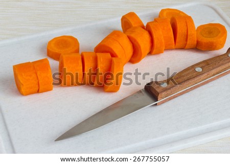 Carrot, sliced on a cutting Board.