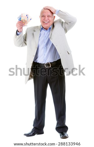 Happy and smile old mature businessman in suit, hold euro money in hand and put second hand over head, isolated on white background. Positive human emotion, facial expression