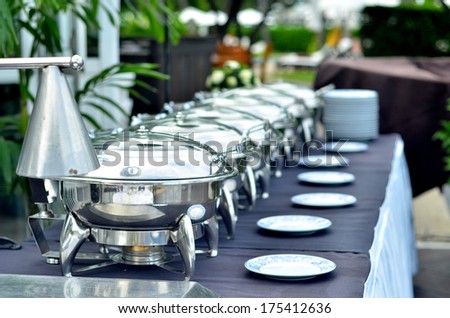 Buffet Table with Row of Food Service Steam Pans