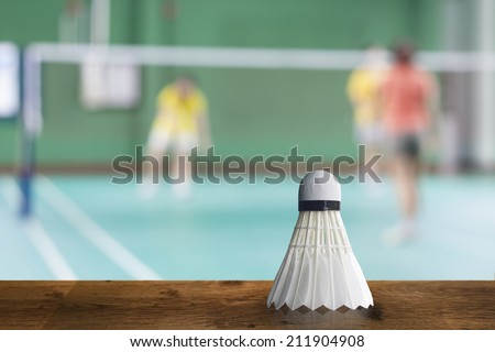 badminton - badminton courts with players competing