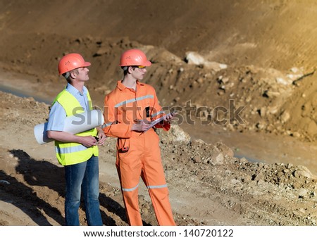 Engineers construction firm. Construction of a new road. Workers repairing the road