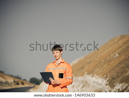 operating a construction company, Construction work on the road, construction of a new road.worker in overalls.