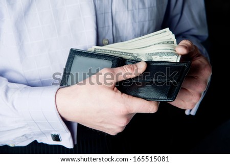 dollars in the men\'s wallet