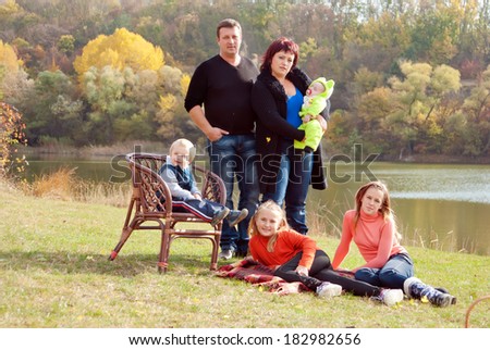Happy large family with children in autumn park