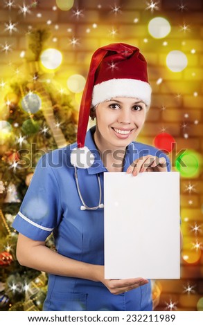 Portrait of smiling doctor woman in santa hat. Doctor - christmas