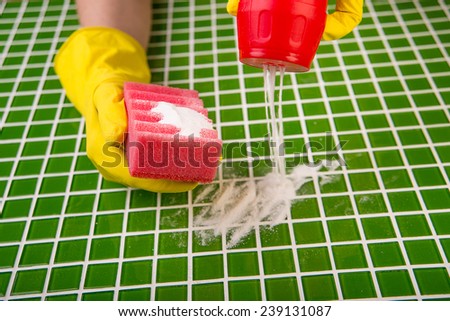 washing the tiles in the bathroom, cleaning kit apartment, hygienic cleaning, gloves, sponge and powder