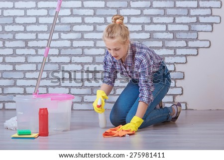 Girl washes the floors