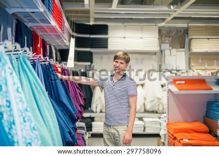 young man buys a towel