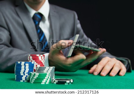 Blackjack Or Poker Game, Casino Worker Shuffling Cards On The Background
