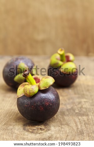 mangosteen fruit on wooden background,still life fruit