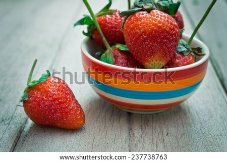 strawberries on an old wooden textured table top