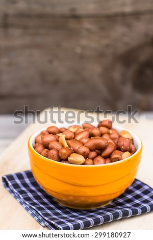salt roasted peanuts  on wood table