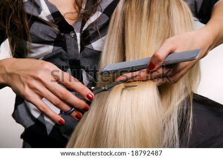 closeup of hairdresser doing haircut