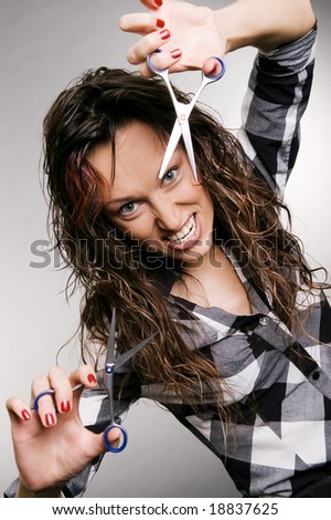 angry hairdresser with scissors over grey background