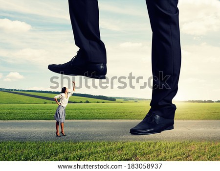 angry woman showing fist and shouting on the big boss at outdoor
