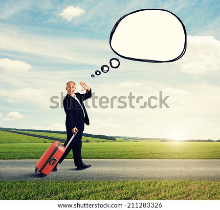 happy senior man walking with case on the road and waving hand at outdoor. concept photo with drawing empty speech bubble