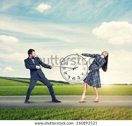 emotional couple with clock at outdoor