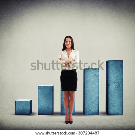 smiley businesswoman in formal wear standing over positive diagram