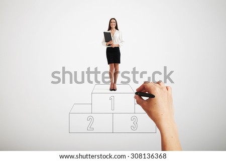 big hand drawing winners podium. happy laughing businesswoman in formal wear standing on sport winners podium and holding black folder over light grey background