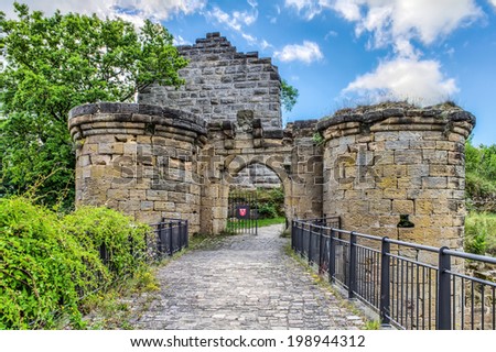 Bavarian Castle Ruin Altenstein in german Franconia. Medieval Romantic Ruins of Germany. Cloudy Blue Summer Sky. Old stone Building, covered with grass