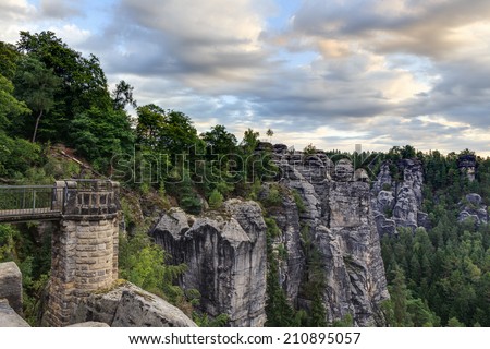 Bastion Bridge in the Saxonian Swiss in Germany, shot on a warm summer morning after sunrise. Landmark of Saxonia. Sandstone Rock Formations. Bridge leading to a former medieval castle near Dresden