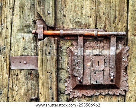 Vintage Door Lock in Southern Germany, Europe. Iron, Rust and old Wood