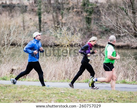 BAMBERG, GERMANY - MARCH 15 2015: Kaiserdomlauf, traditional long distance race event in the City of Bamberg in Bavaria, Germany in March 2015. People running