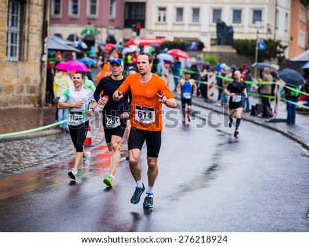 BAMBERG, GERMANY - MAY 03 2015: Weltkulturerbelauf, traditional long distance race event on a rainy day in the world culture heritage City of Bamberg in Franconia, Germany in May 2015