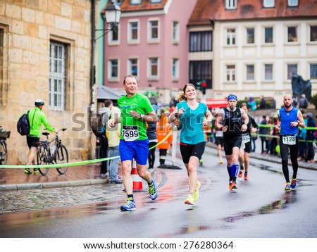 BAMBERG, GERMANY - MAY 03 2015: Weltkulturerbelauf, traditional long distance Marathon race event on a rainy day in the world culture heritage City of Bamberg in Franconia, Germany in May 2015
