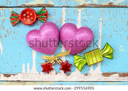Couple hearts with accessory on wooden board, Valentines day background