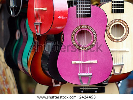 colorful guitars in musical instruments shop