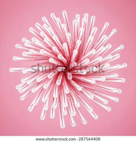 red striped cocktail straws in glass overhead view