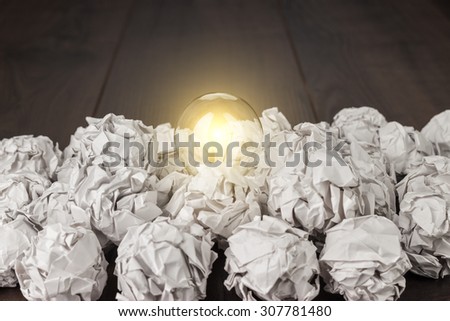 idea concept with crumpled office paper and light bulb