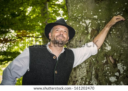 Portrait of happy man with traditional Bavarian costume