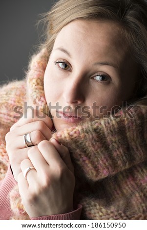 Portrait of a young woman with wool scarf