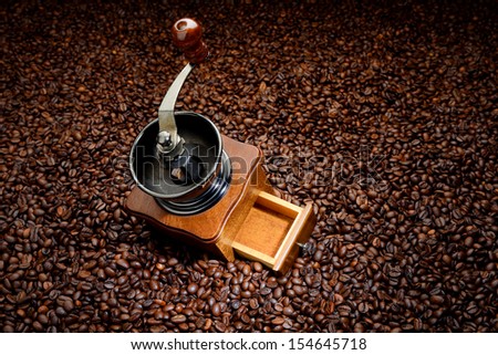 Coffee beans and old hand grinder. Background concept