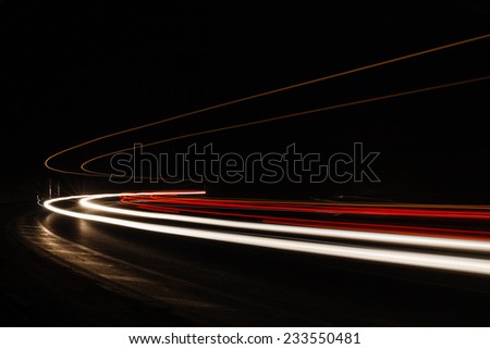 Light trails in tunnel. Art image. Long exposure photo taken in a tunnel.