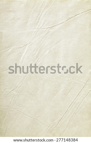 Old sheet of paper folded and battered, with paper texture.