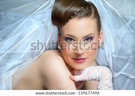 Portrait of young and beautiful bride veil