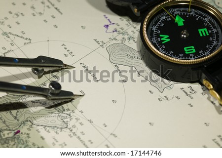 Navigational tools and compass on a nautical navigation map